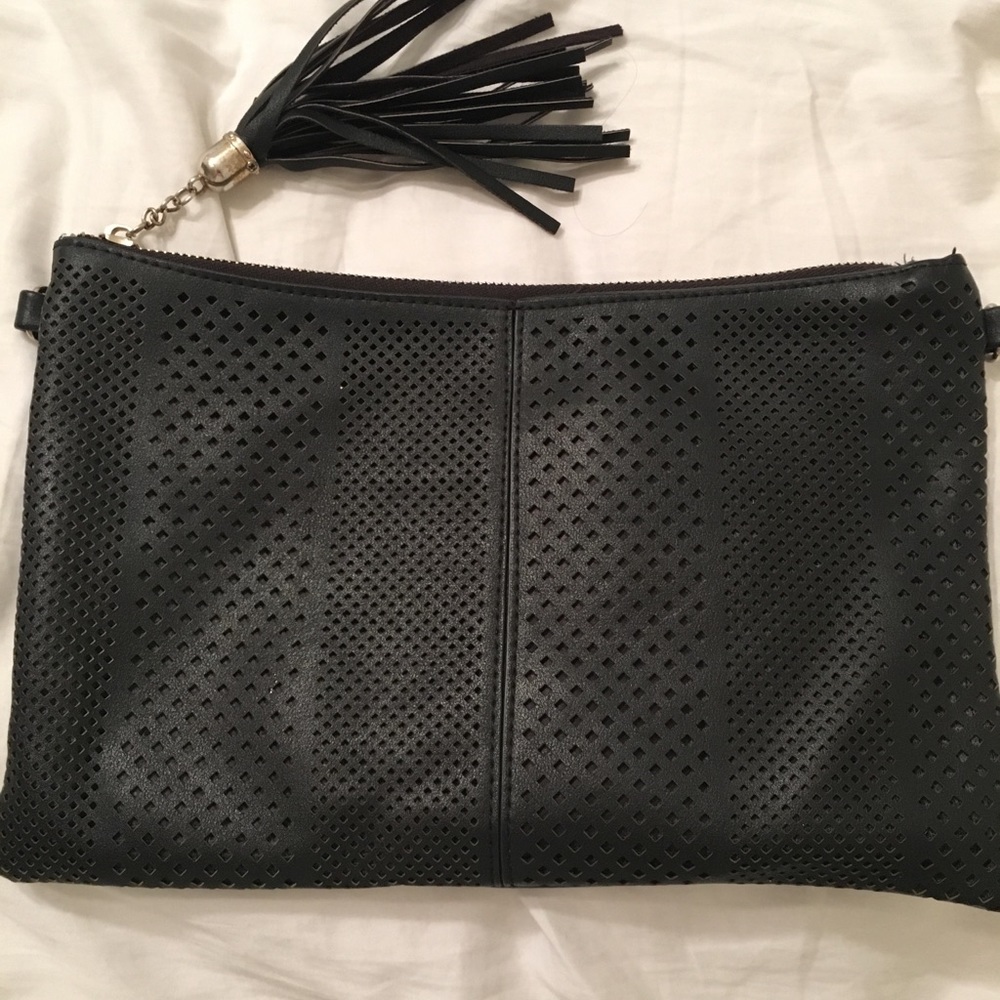 Black perforated vegan leather clutch with tassel